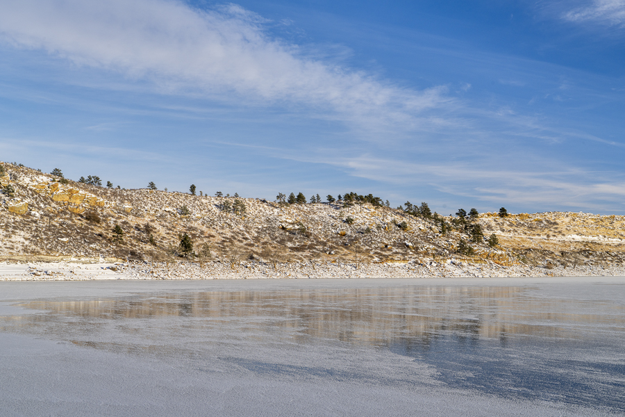 winter scenery of northern Colorado foothills - frozen Horsetooth Reservoir