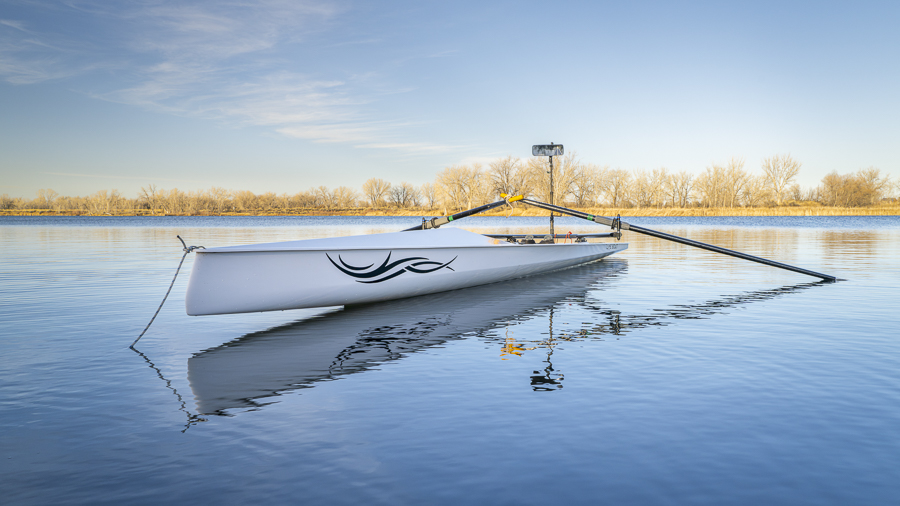 Fort Collins, CO, USA - March 1, 2024: Coastal rowing shell by Liteboat on a lake in northern Colorado in winter or early spring scenery.